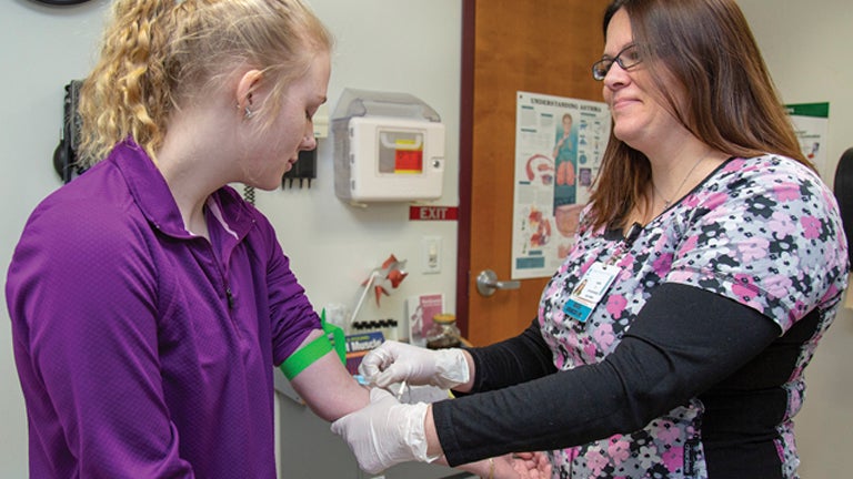 Delaware Academy Elementary & Middle/High School-Based Health Practitioner Helping Student