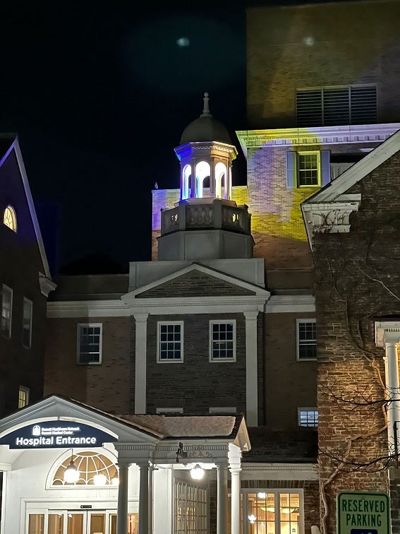 Bassett Medical Center's cupola lit up yellow and blue to show solidarity with Ukraine