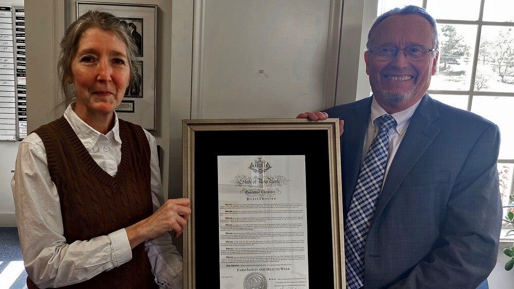 Julie Sorensen, PhD with Commissioner of Agriculture and Markets Richard Ball