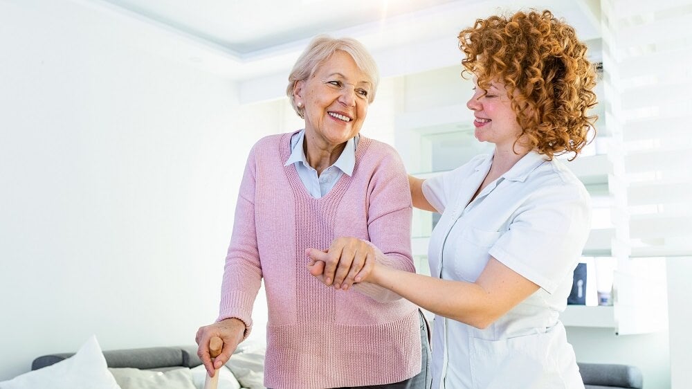 At Home Care, Inc. Practitioner Helping Patient