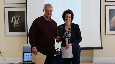Lisa Betrus accepting the award for Senator Seward from Bill Zittel, NYCAMH Advisory Board Chairman