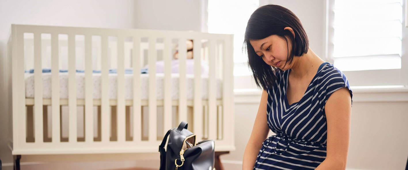 Mother-to-be packing hospital bag