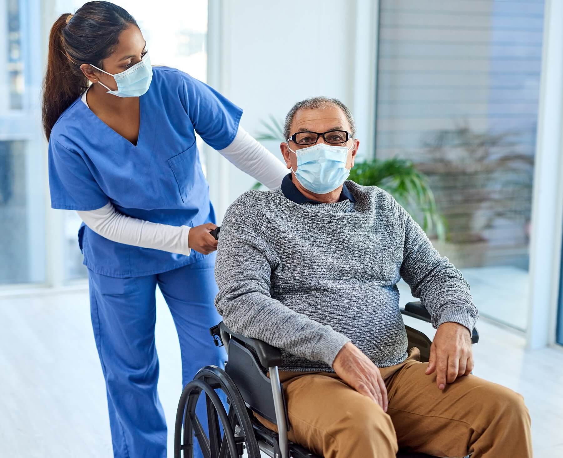 VHS CNA helping a resident