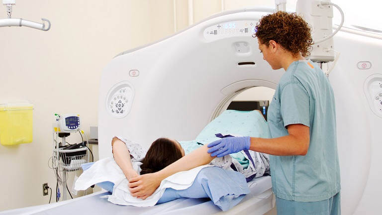 patient and doctor in imaging room
