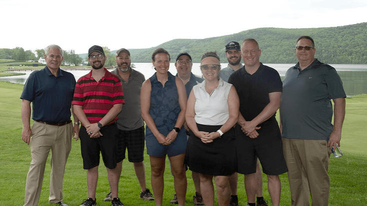 Golfers & Friends of Bassett board members posing for a group photo on the Leatherstocking Golf Course