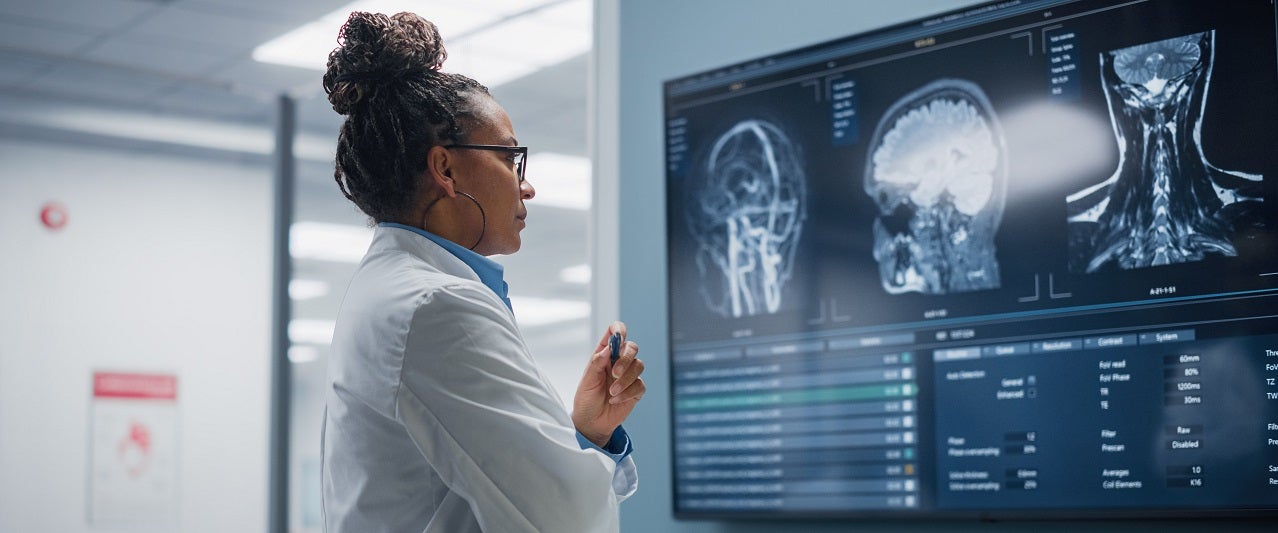 Neurologist reviewing imaging scans
