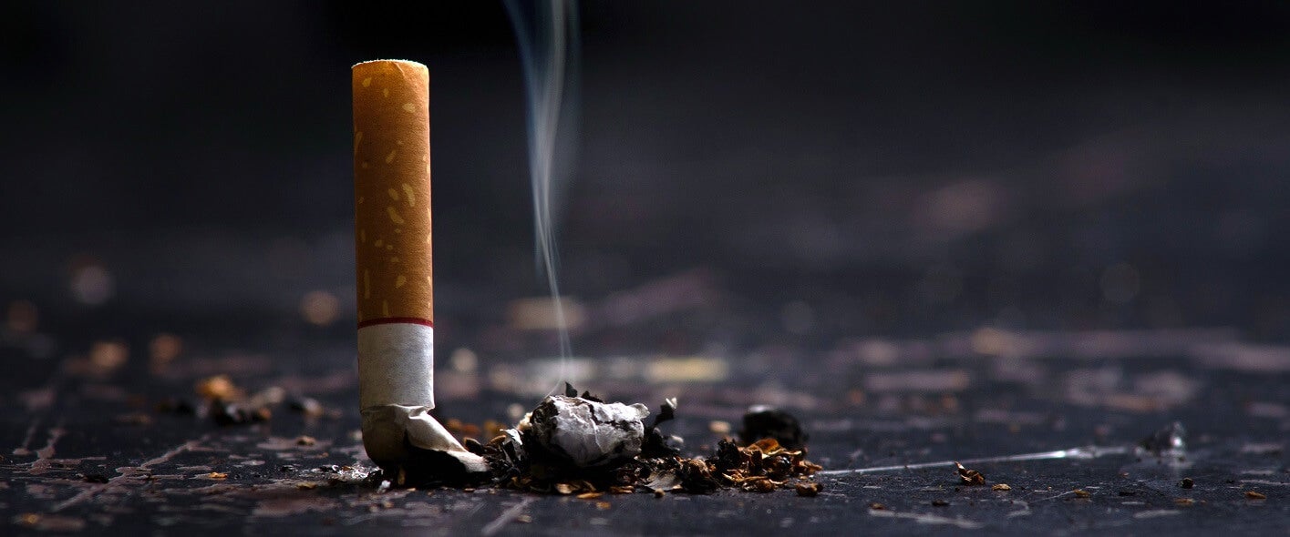 Burning cigarette put out to indicate quitting smoking