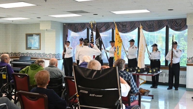 VVA Chapter 944 color guard posts the flags before the gathered crowd. 