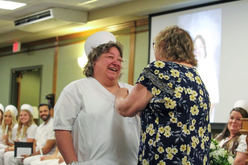 Laura Palada, instructor, pins her best friend, Lucinda (Cindy) Newell