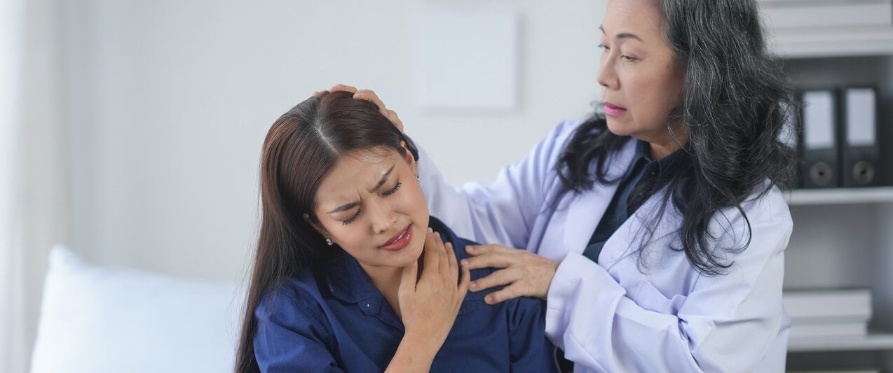 Provider helping a patient who is experiencing chronic pain