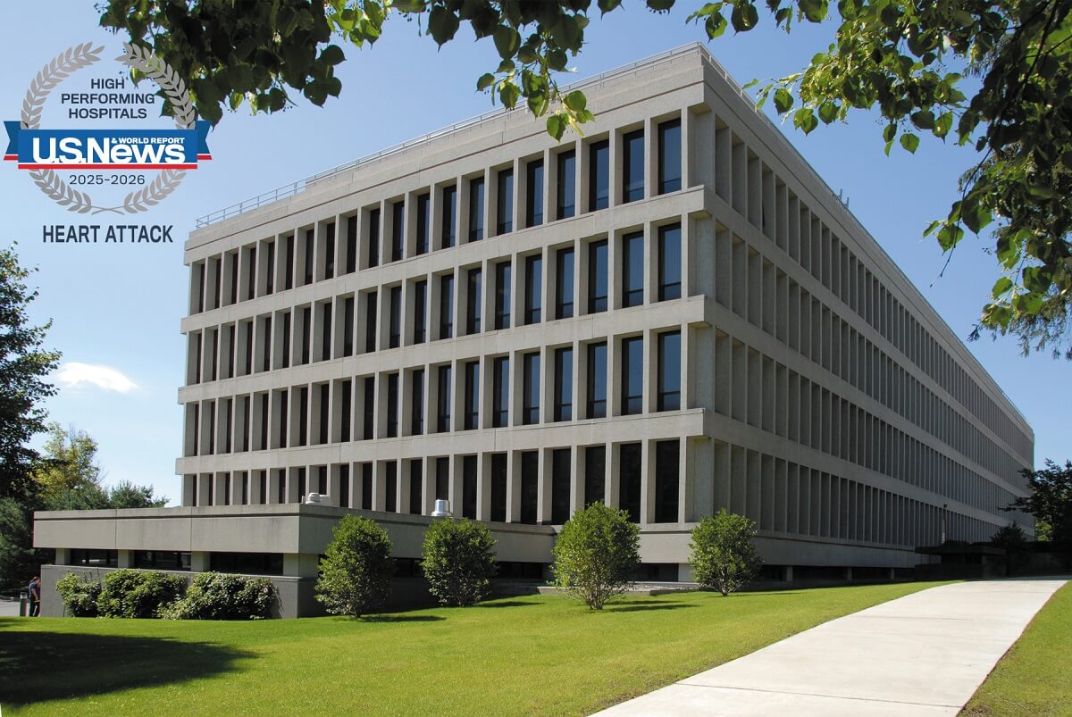 Bassett Medical Center Hospital Building with U.S. News & World Heart Attack Treatment Award Logo