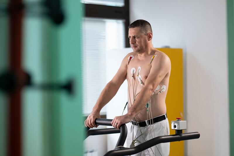 Patient Undergoing a Cardiology Diagnostic Stress Test with Leads Attached While He's on a Treadmill