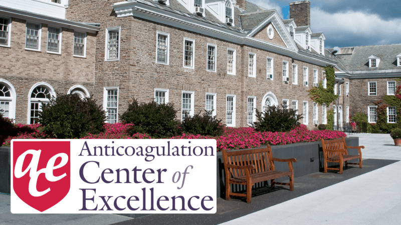 A seal naming it an Anticoagulation Center of Excellence is edited on a photo of Bassett Medical Center's Fieldstone building. 