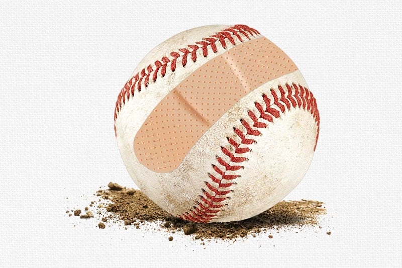 Baseball with a band-aid on it