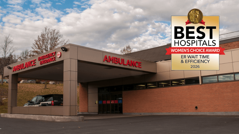 A photo of Cobleskill Regional Hospital has a seal placed on it. The seal reads "Best Hospitals Women's Choice Awards ER Wait Time and Efficiency 2026."