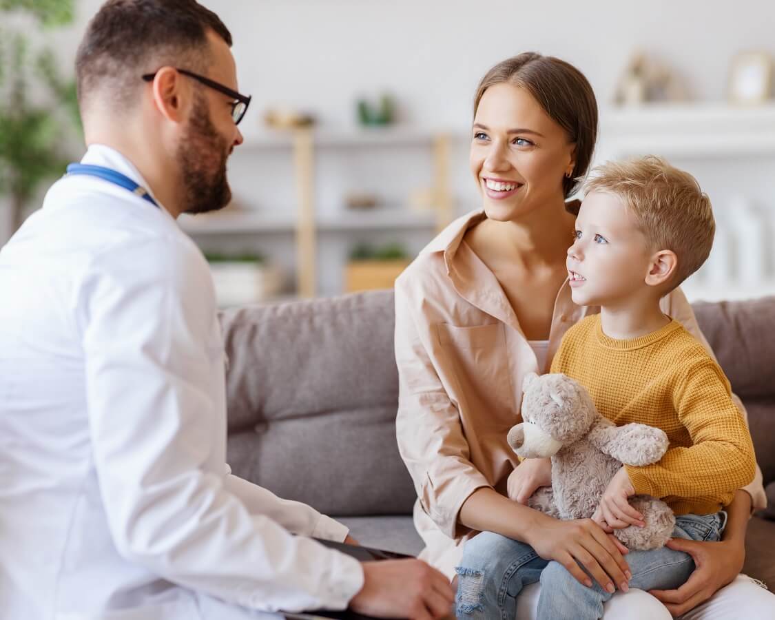 Pediatric Urologist meeting with a mother and young boy patient
