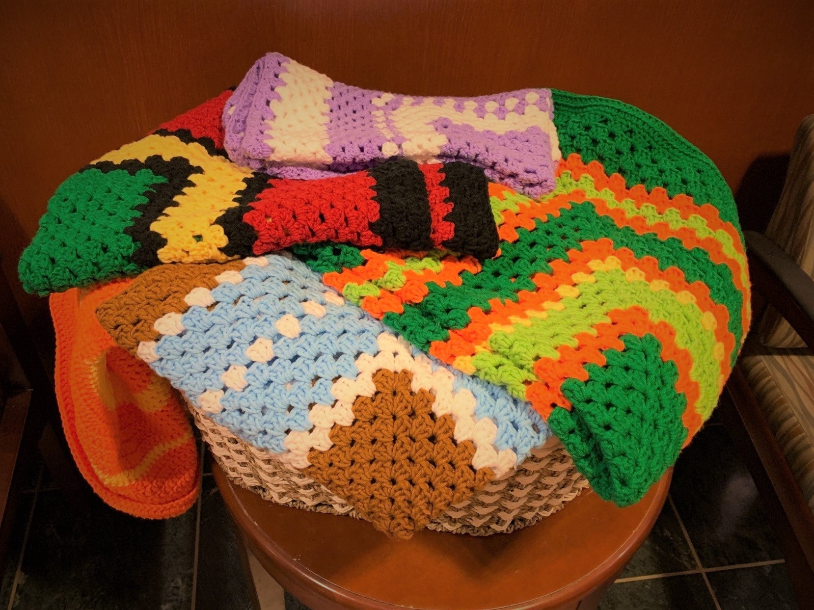 Basket of Donated Infant Blankets, Headbands, and Hats