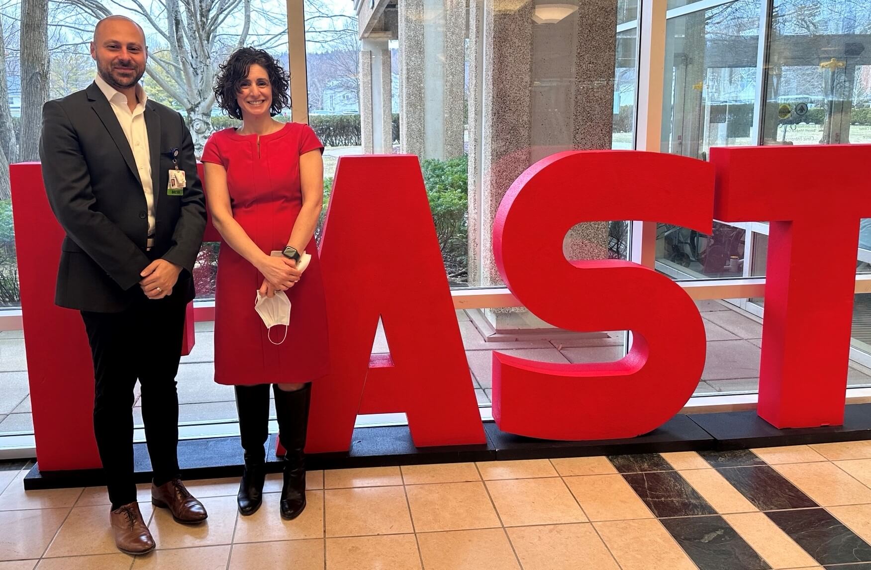 Dr. Ibrahim & Christine Kisiel standing in front of life-sized FAST letters