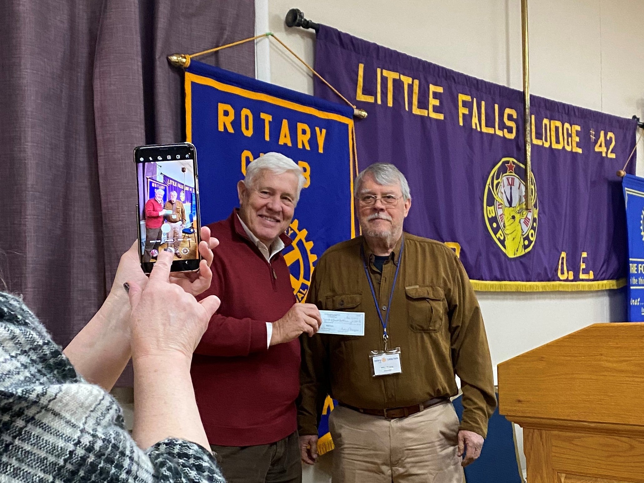 Ben Everidge accepts check from Mike Evans