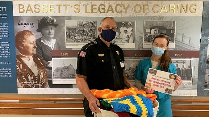 Nursing Assistant Accepting Donated Items on Behalf of Birthing Center