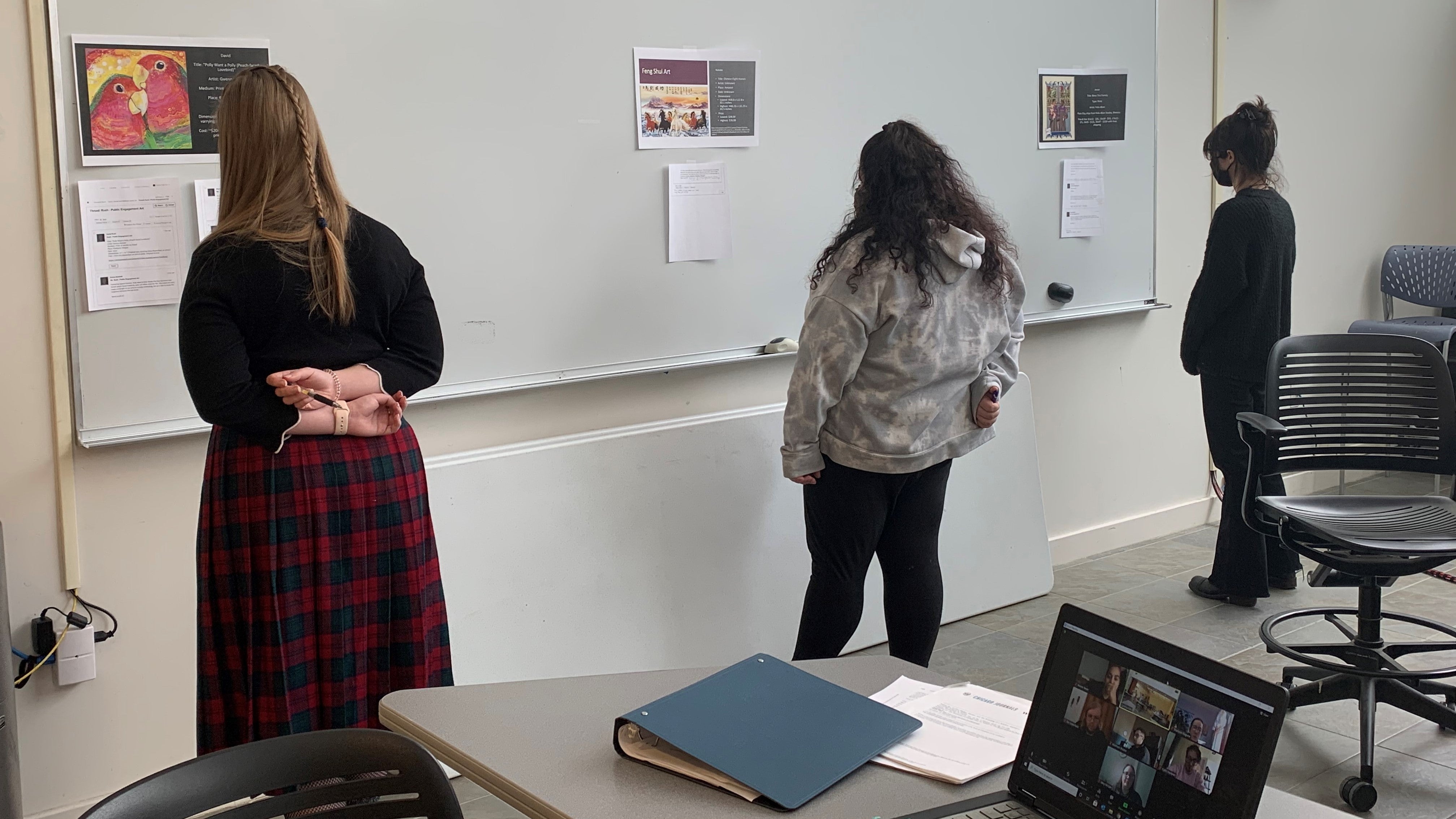 Graduate Students Looking at Artwork