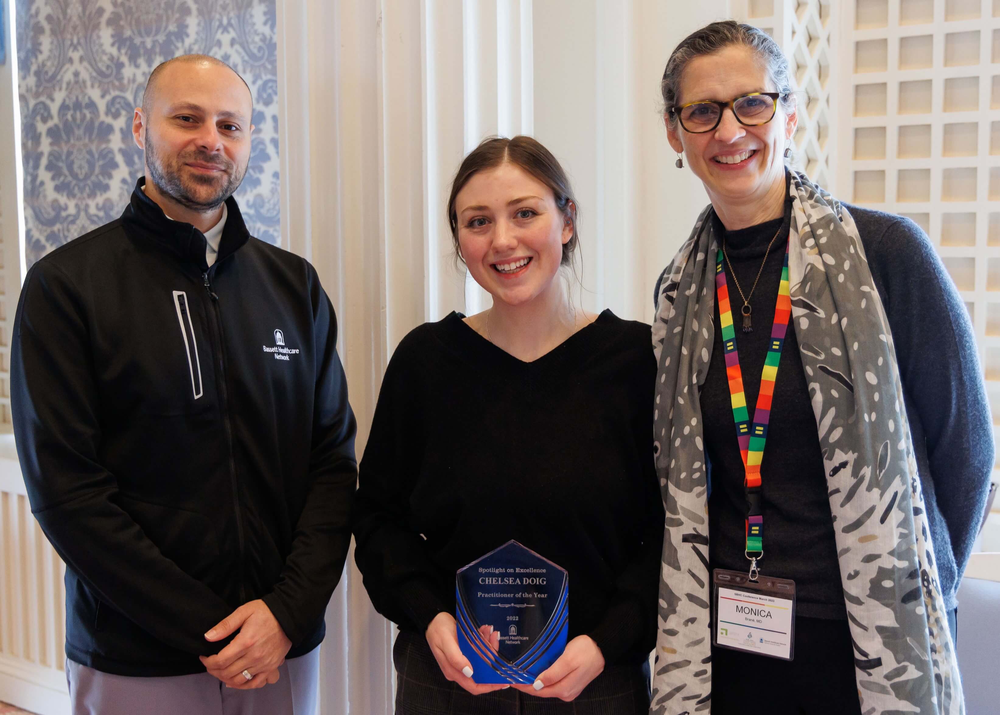 Chelsea Doig, PA standing with her Practitioner of the Year award, along with Dr. Tommy Ibrahim & Dr. Monica Brané