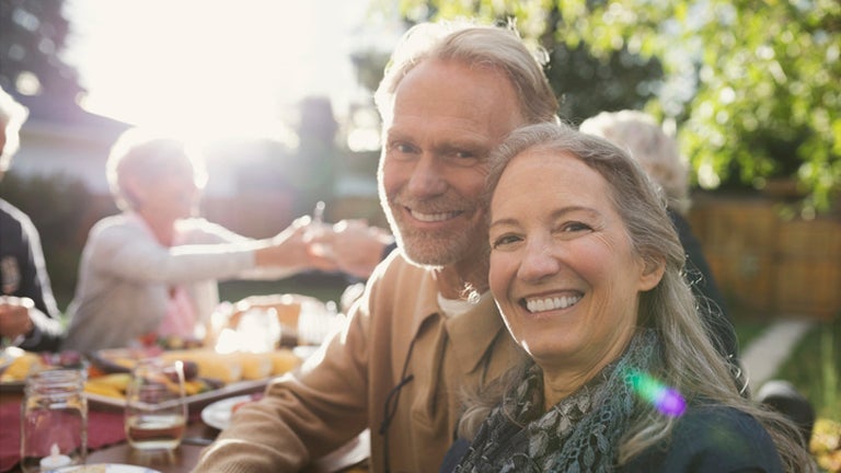 Man and woman sitting and smiling 