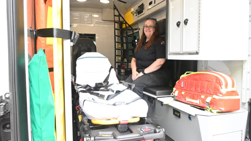 Angela Barnes sites inside of the recently purchased emergency transport vehicles.