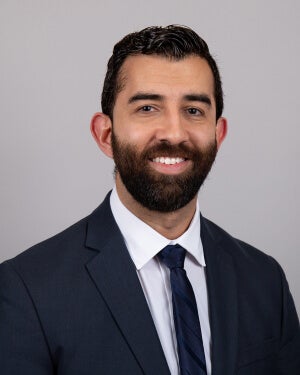 A man in a suit and tie is photographed
