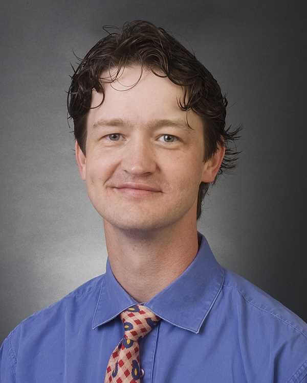 A man, Dr. J. Daniel Croft, is photographed. He is wearing professional attire and smiling for the camera.