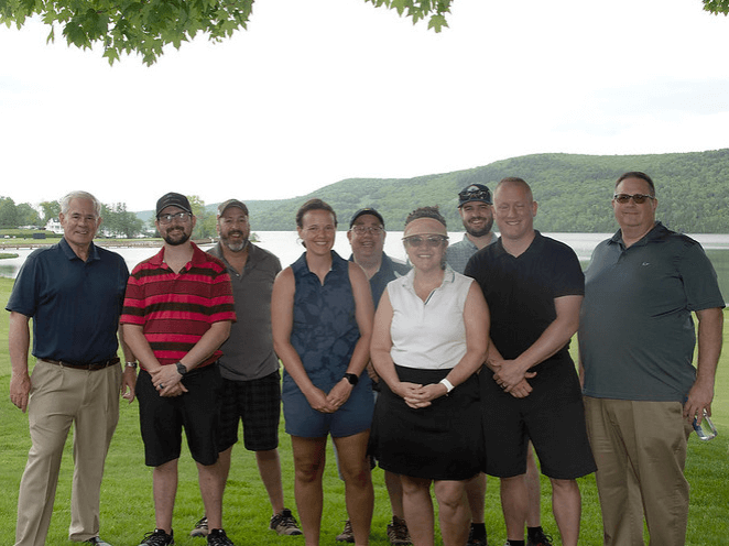 Golfers & Friends of Bassett board members posing for a group photo on the Leatherstocking Golf Course