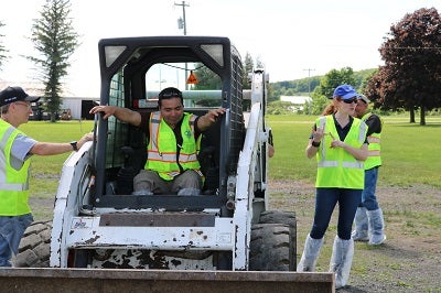 NYCAMH Workers Giving Skid Steer Safety Training