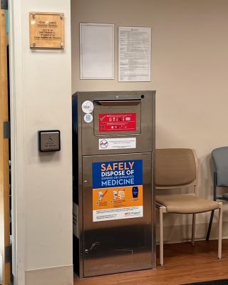 A metallic collection kiosk in a seating area